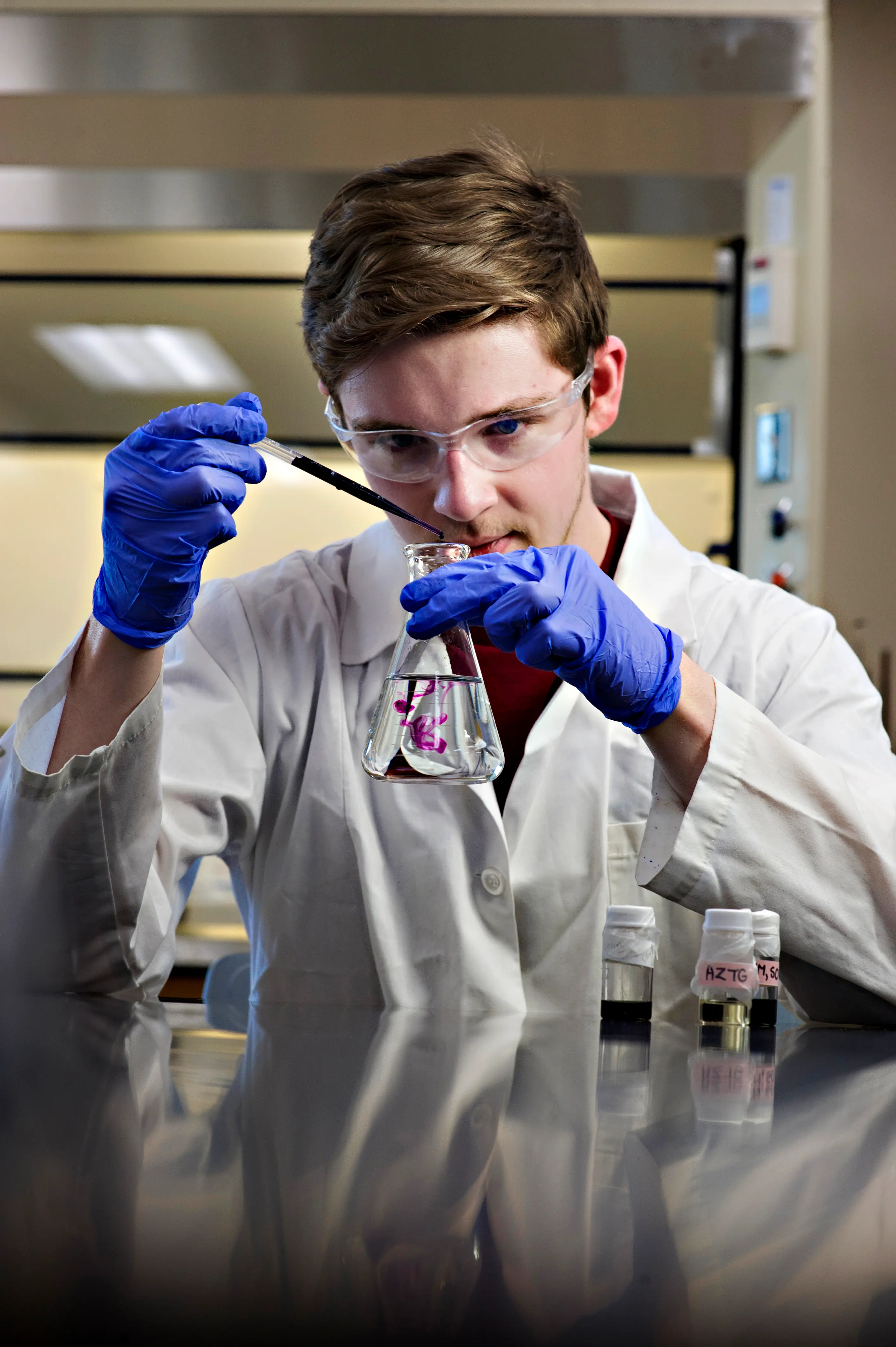 Miles with a graduated cylinder