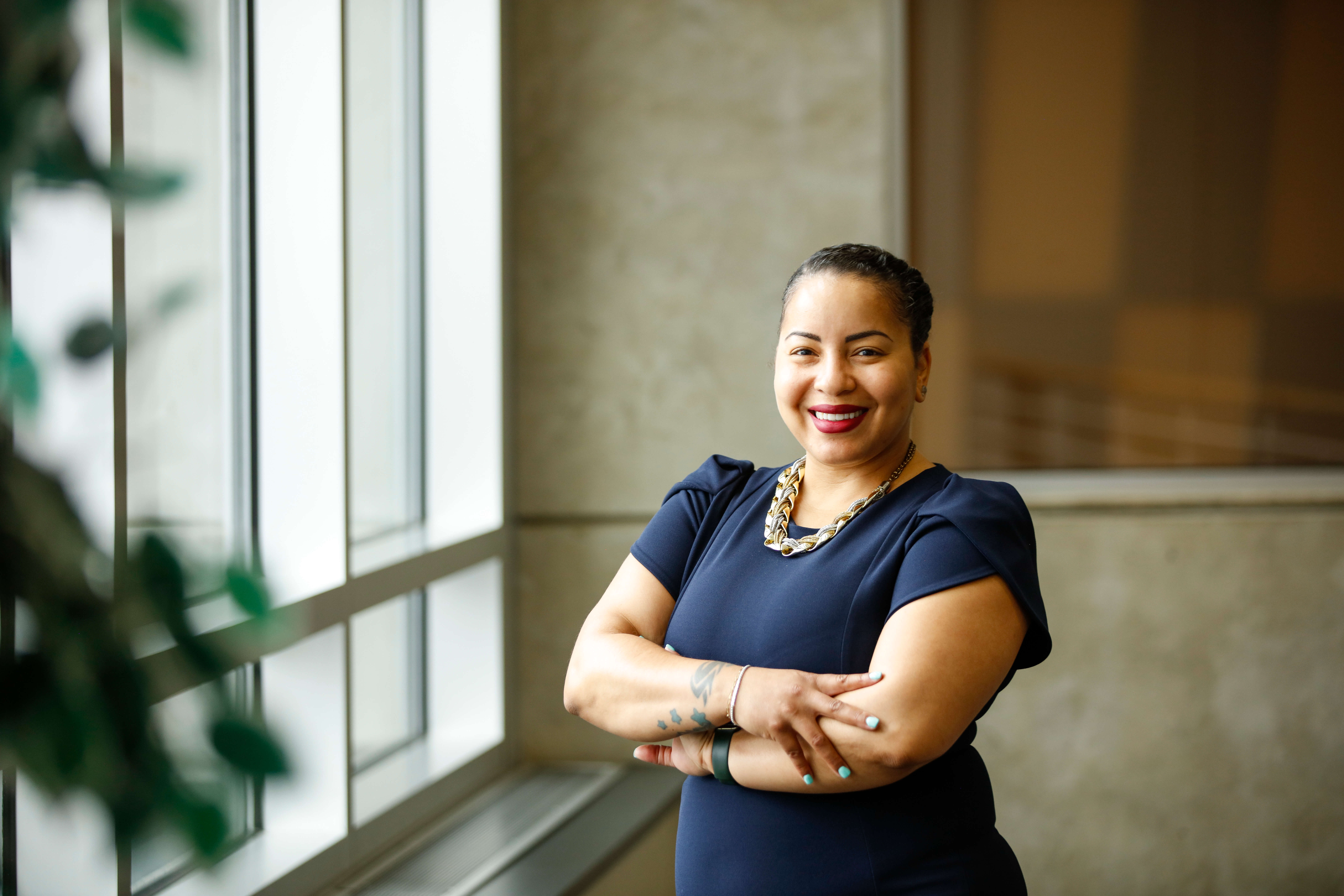 A confident graduate student smiling