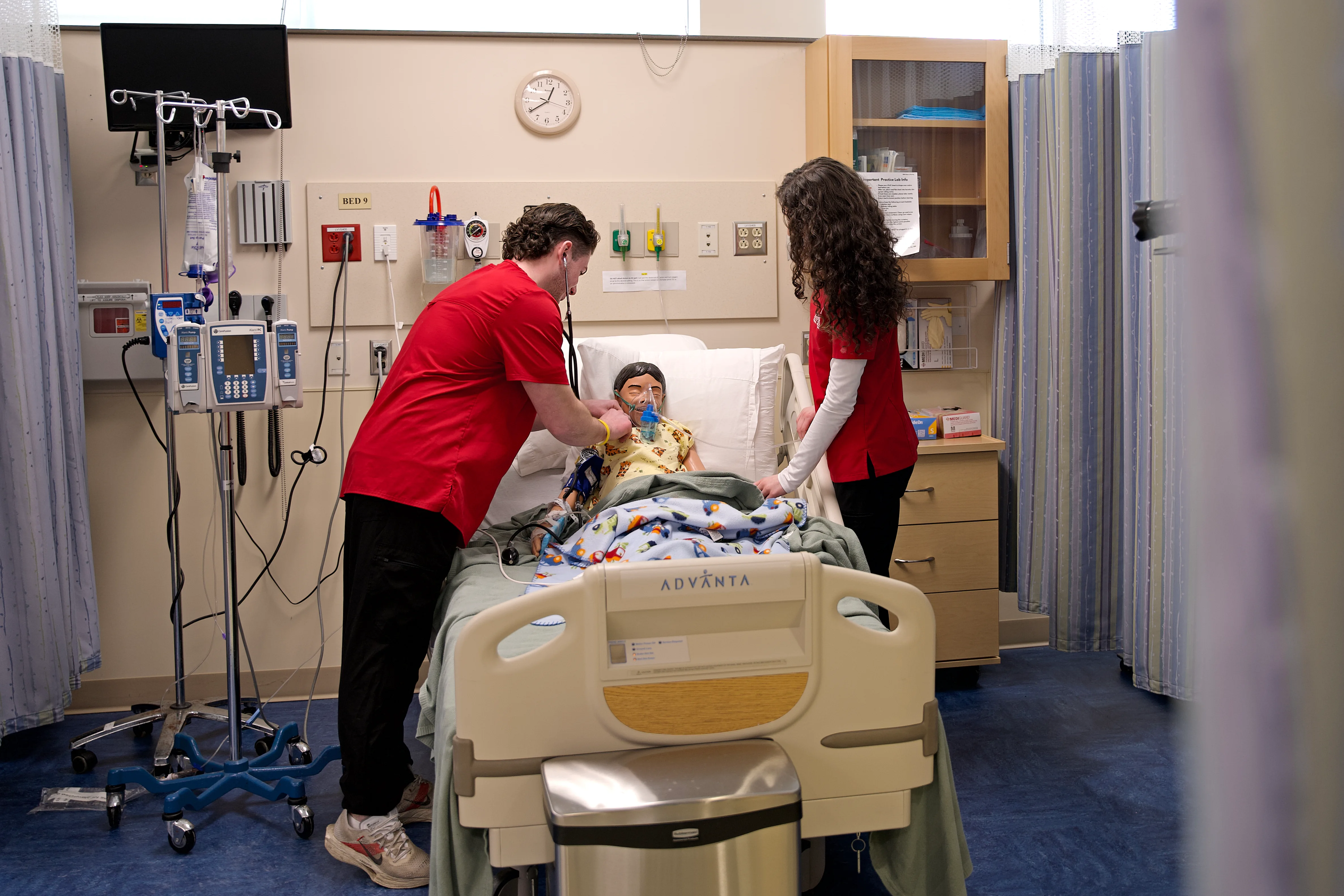 Nursing students work in simulation lab