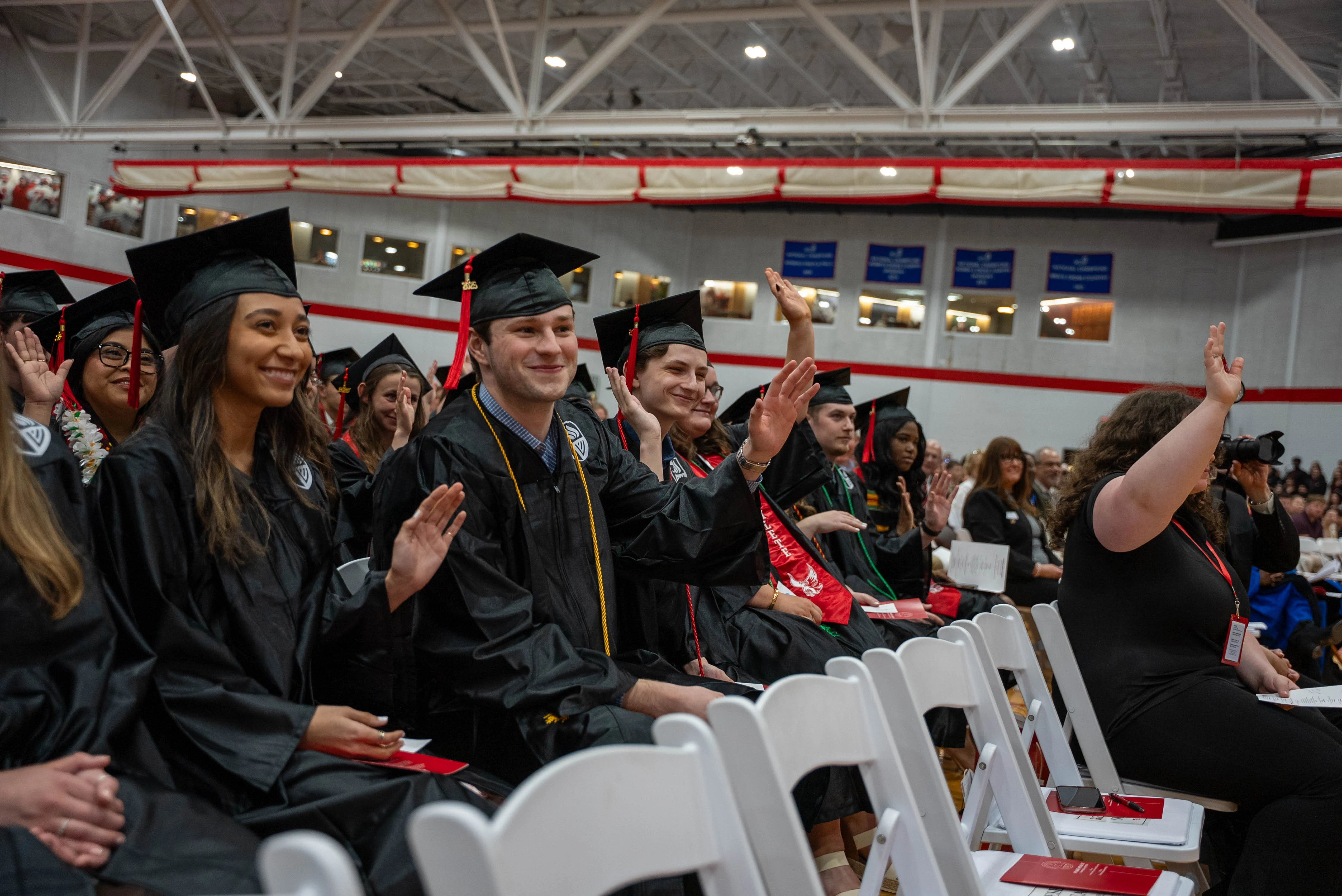 Graduates Raising Hand