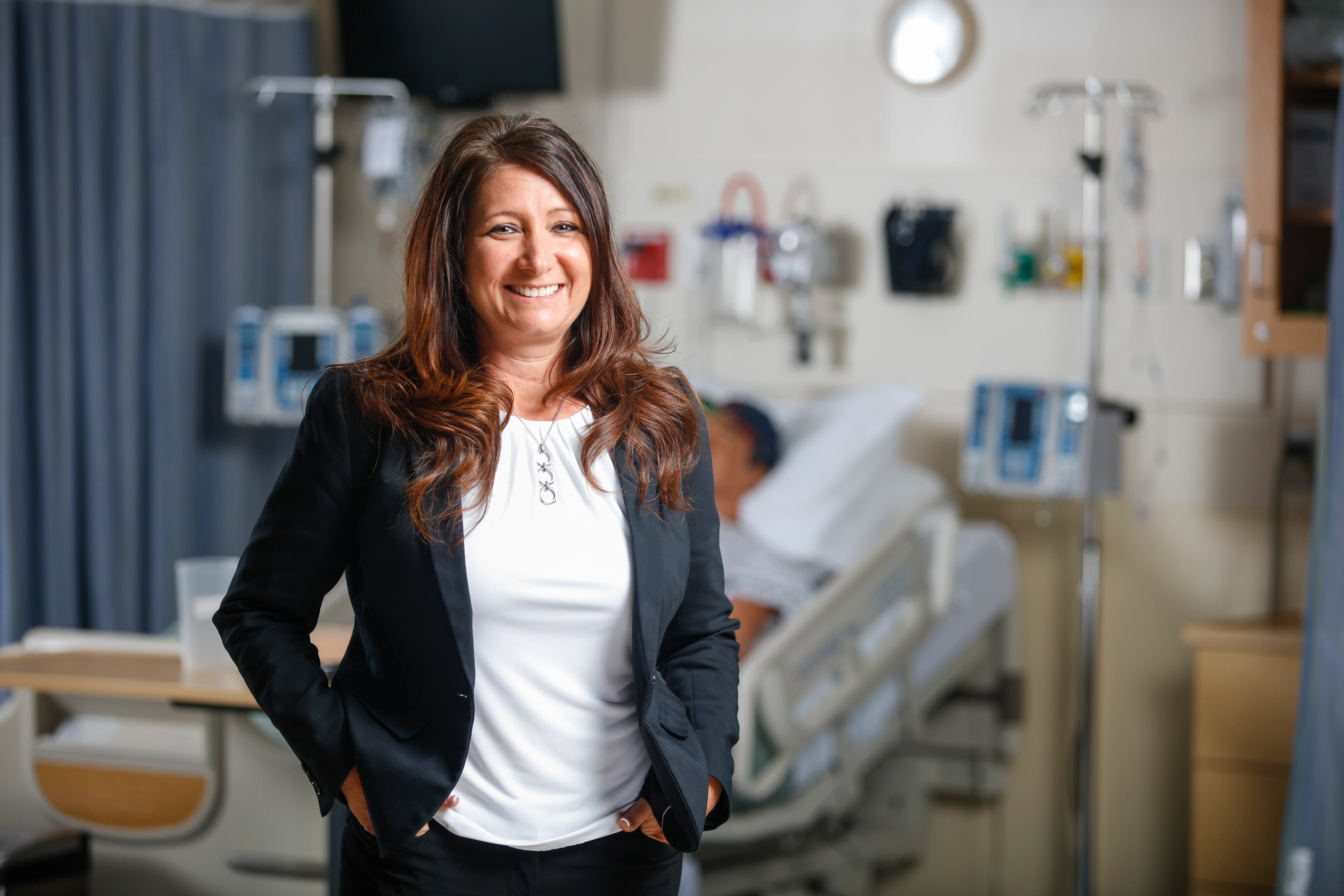 A nurse leader smiles